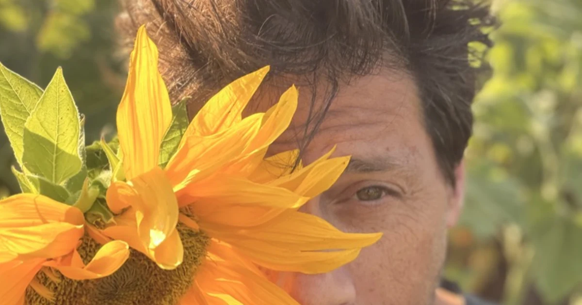 Tal Agmon with the sunflower that represents how he approaches product work
