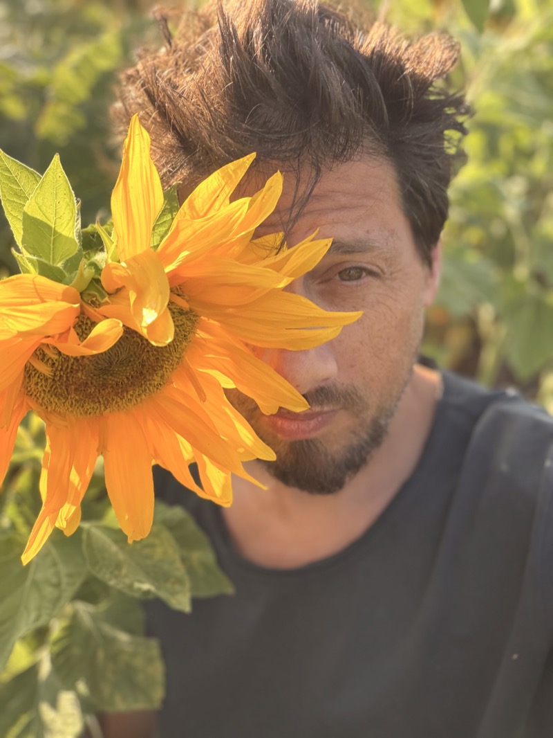 Tal Agmon with a sunflower